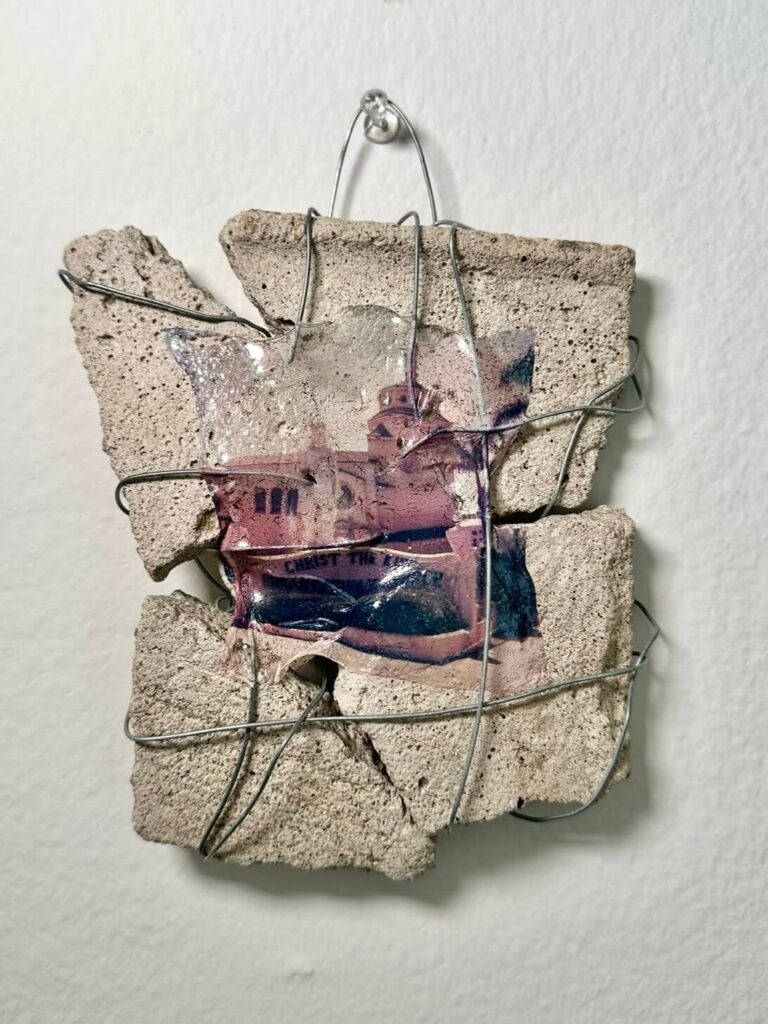 polaroid emulsion on concrete. pieces of broken concrete are wire wrapped together, and a ghostly polaroid emulsion is adhered to the materials. created by nat belacse-welch, also known as nataly welch
